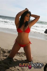 Sunny Leone wearing a red bikini