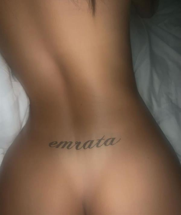 Emily Ratajkowski naked new photo in bed showing off her temporary emrata tattoo right above her perfect nude ass.