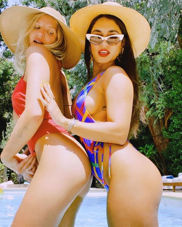 Vanessa Hudgens boobs showing nice sideboob cleavage with her big tits in a sexy swimsuit with GG Magree after working out.