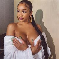 Saweetie topless boobs on display as she is waring just a robe she pulled down to show off her nude big tits.