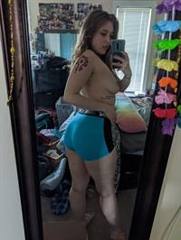 Electra Rayne taking a selfie and - breasts