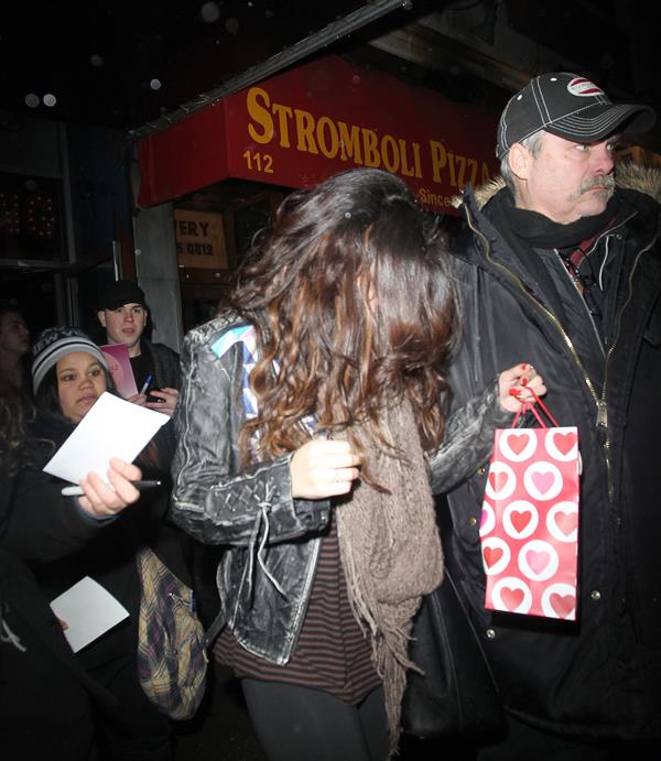 Selena Gomez surrounded by fans for autographs in New York City on February 5, 2013