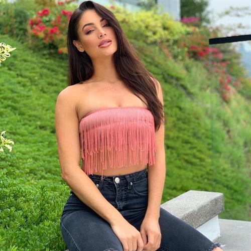 Ripped Black Jeans and Fringe Halter Top