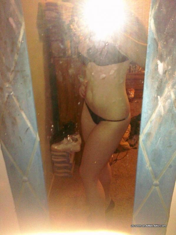 Anonymous in lingerie taking a selfie