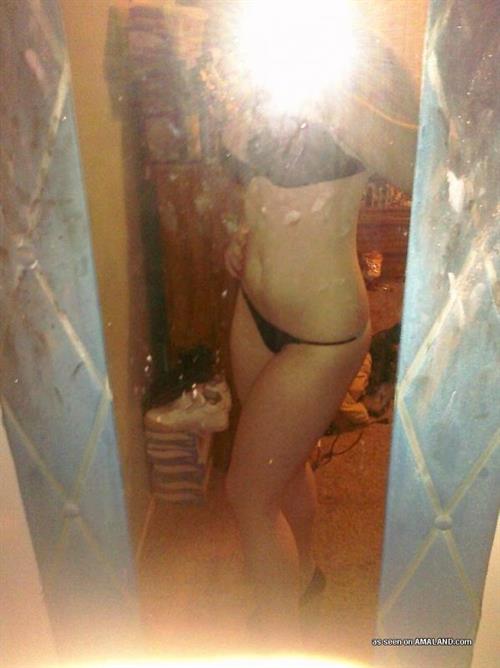 Anonymous in lingerie taking a selfie