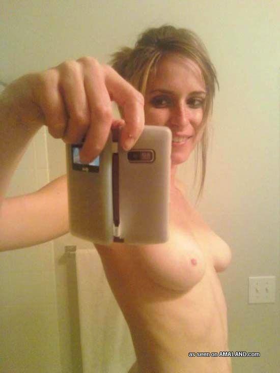 Anonymous taking a selfie and - breasts