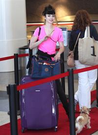 Krysten Ritter - Prepares to leave LAX in Los Angeles, California - June 8, 2012 