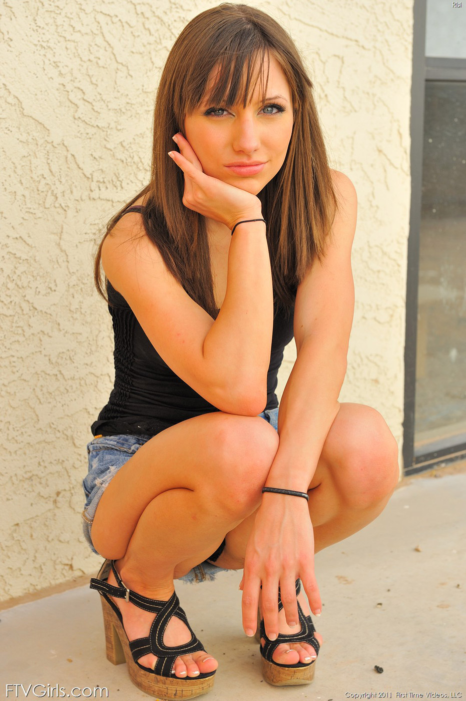 Risi in a skirt and heels flashing outdoors