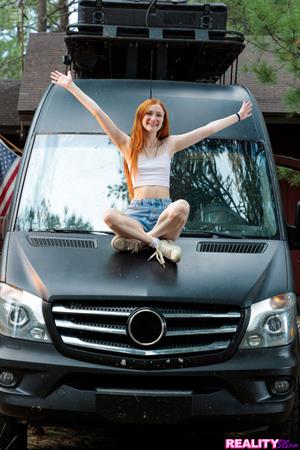 Exhibitionist redhead Scarlet Skies shows us her new van and then how she fucks her stepbrother on the bed inside