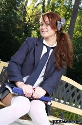 Firery redheaded school girl strips outdoors