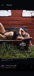 Lisa Marie Zychowski in a bikini taking a selfie