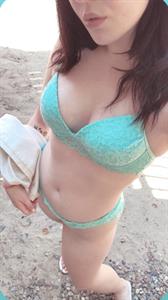 Anonymous in a bikini in lingerie taking a selfie