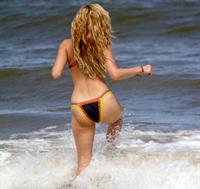 Kelly Brook in a bikini - ass