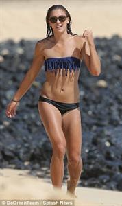 Alex Morgan and Sydney Leroux in bikinis on the beach in Hawaii