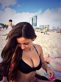 Angie Varona in a bikini taking a selfie