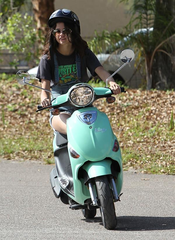 Selena Gomez rides a scooter on set of spring breakers on February 29, 2012 